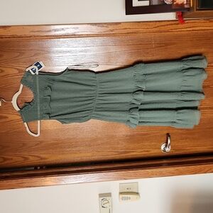 Sage green ruffle dress. Medium